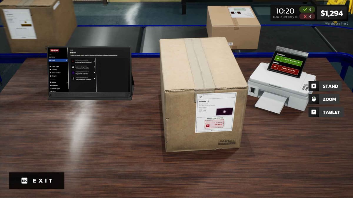 A desk workspace showing a parcel, laptop with sorting criteria, and scanner equipment